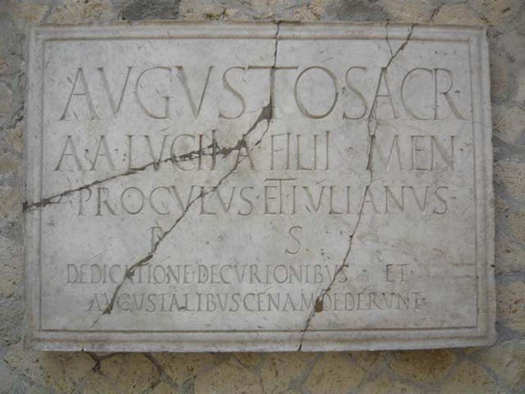 VI.21 Herculaneum. August 2013. Plaque dedicated to Augustus. Photo courtesy of Buzz Ferebee.